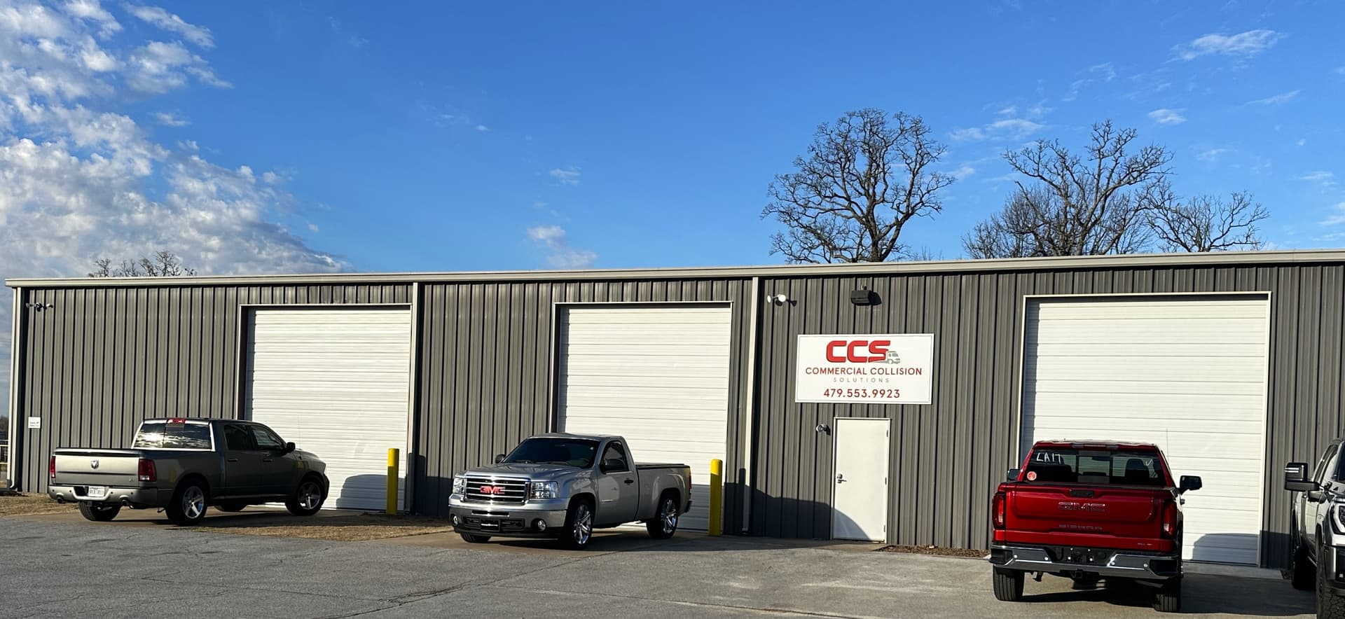 Commercial Collision Solutions facility exterior with CCS signage